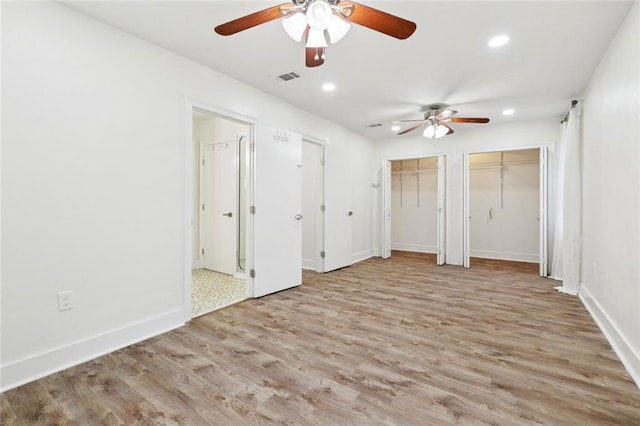 1112 Kent Ave, Metairie, LA 70001 - unfurnished bedroom with wood finished floors, recessed lighting, two closets, and ceiling fan
