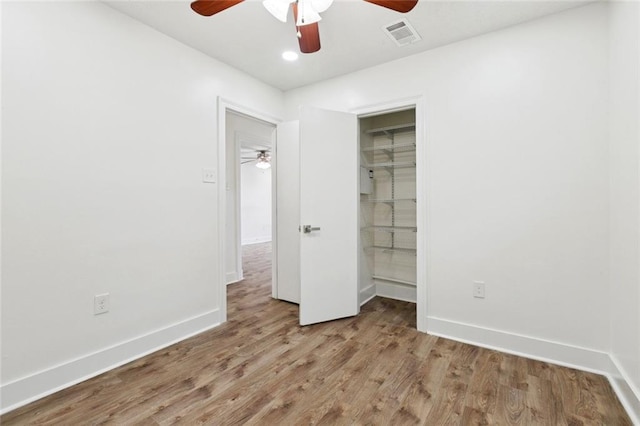 1112 Kent Ave, Metairie, LA 70001 - unfurnished bedroom featuring wood finished floors, recessed lighting, ceiling fan, and a closet