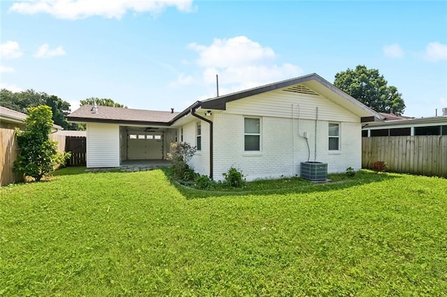 1112 Kent Ave, Metairie, LA 70001 - back of property with brick siding, a fenced backyard, and a garage