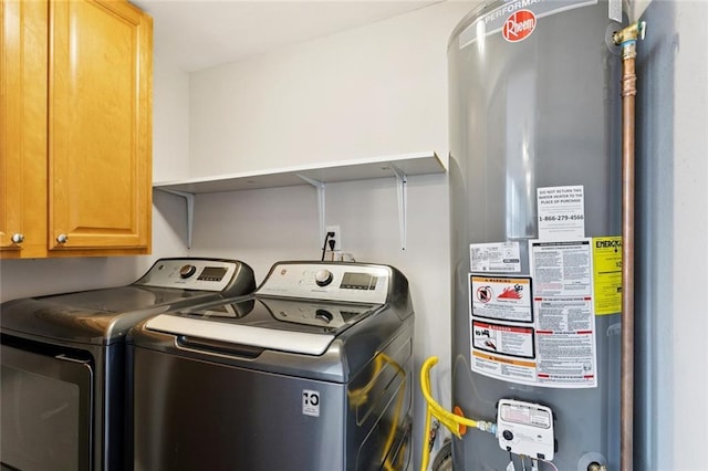 8021 Shirley St, Metairie, LA 70003 - laundry room featuring water heater, cabinet space, and washing machine and clothes dryer