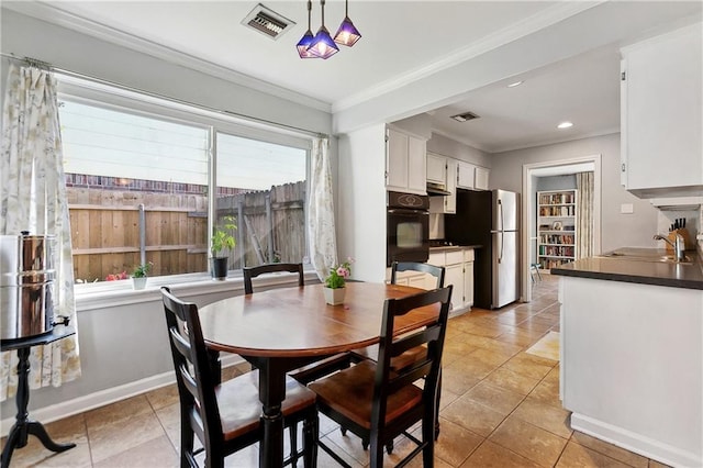 2638 Gallinghouse St, New Orleans, LA 70131 - dining room with crown molding and light tile patterned floors