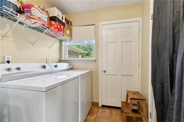 2638 Gallinghouse St, New Orleans, LA 70131 - washroom featuring washer and clothes dryer and light tile patterned flooring