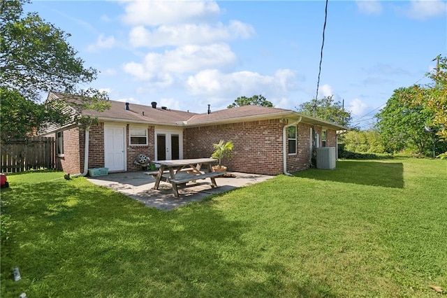 2638 Gallinghouse St, New Orleans, LA 70131 - back of property featuring a patio area, brick siding, and french doors
