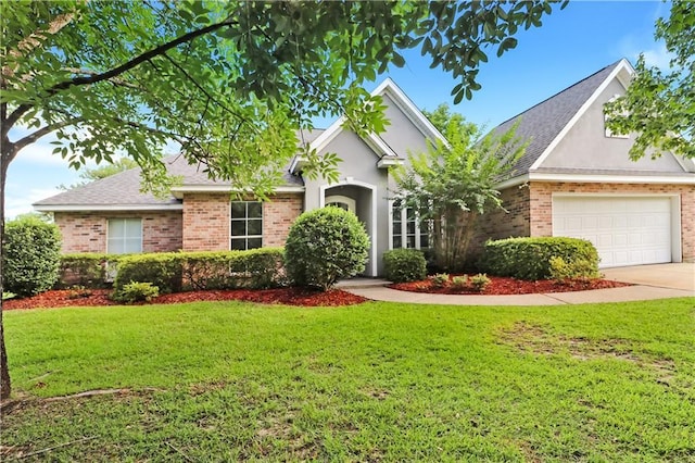 1022 Forest Ridge Loop, Pearl River, LA 70452 - view of front of home with an attached garage, a front yard, driveway, brick siding, and a shingled roof
