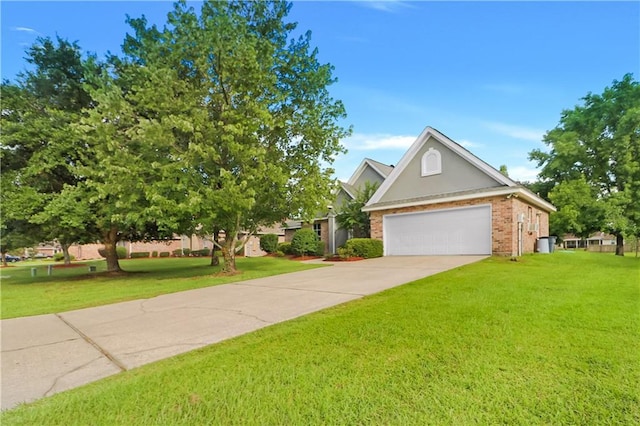1022 Forest Ridge Loop, Pearl River, LA 70452 - view of front of property with a front lawn, brick siding, concrete driveway, and stucco siding