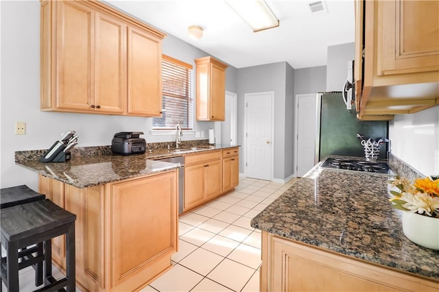 1022 Forest Ridge Loop, Pearl River, LA 70452 - kitchen with light brown cabinetry, a peninsula, light tile patterned floors, and a breakfast bar