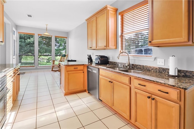 1022 Forest Ridge Loop, Pearl River, LA 70452 - kitchen featuring dishwasher, a peninsula, dark stone countertops, light tile patterned flooring, and decorative light fixtures