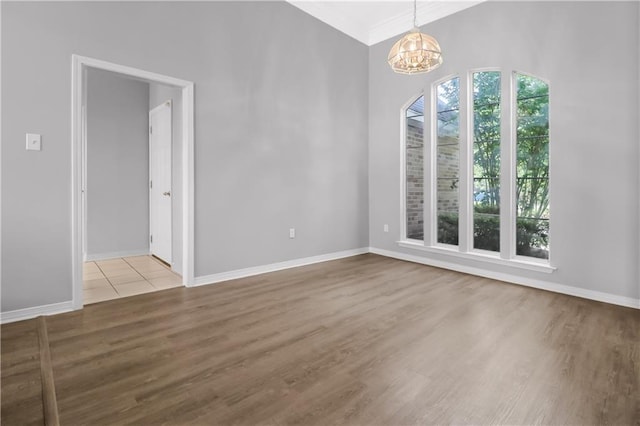 1022 Forest Ridge Loop, Pearl River, LA 70452 - unfurnished room with a chandelier, wood finished floors, and crown molding