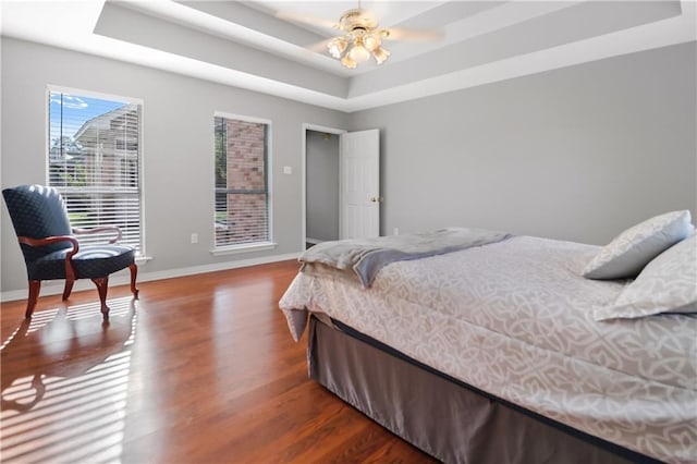 1022 Forest Ridge Loop, Pearl River, LA 70452 - bedroom with a tray ceiling and wood finished floors