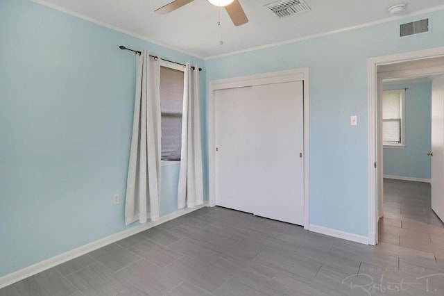 405 Jade Ave, Metairie, LA 70003 - unfurnished bedroom with ornamental molding, a closet, and a ceiling fan