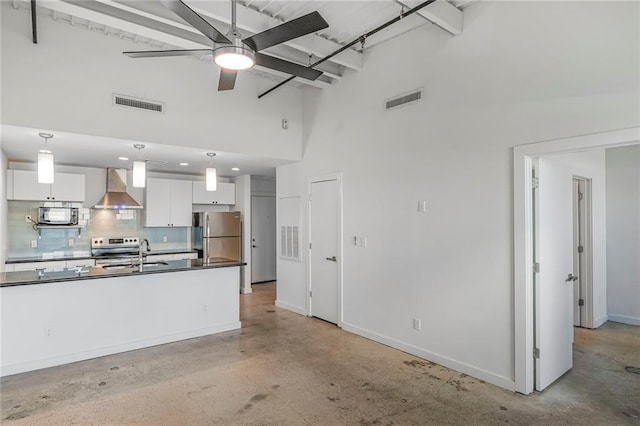 2606 St Louis St Unit H, New Orleans, LA 70119 - unfurnished living room featuring concrete flooring, a towering ceiling, ceiling fan, and beam ceiling