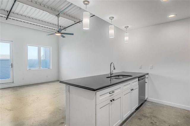 2606 St Louis St Unit H, New Orleans, LA 70119 - kitchen featuring finished concrete flooring, stainless steel dishwasher, dark countertops, white cabinetry, and hanging light fixtures