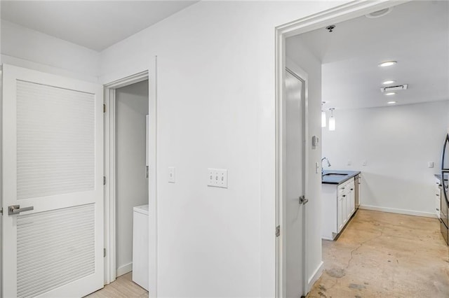 2606 St Louis St Unit H, New Orleans, LA 70119 - hall with a sink and concrete flooring