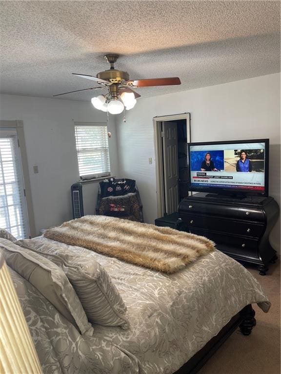 722 Marina Dr Unit 722, Slidell, LA 70458 - carpeted bedroom with a textured ceiling and ceiling fan
