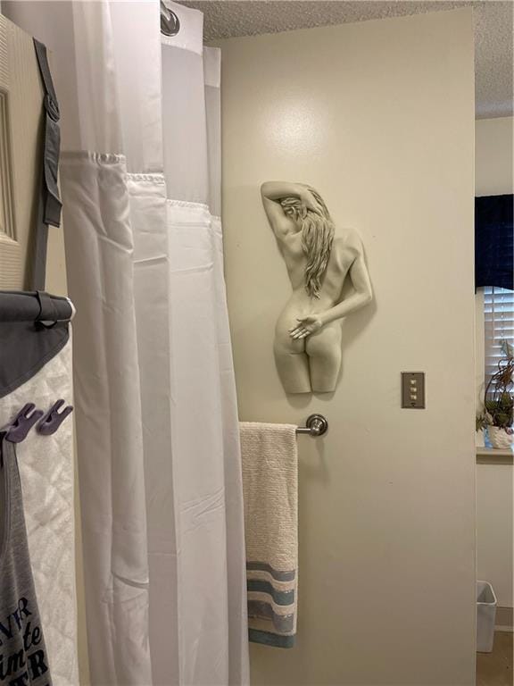 722 Marina Dr Unit 722, Slidell, LA 70458 - bathroom view of a textured ceiling and curtained shower