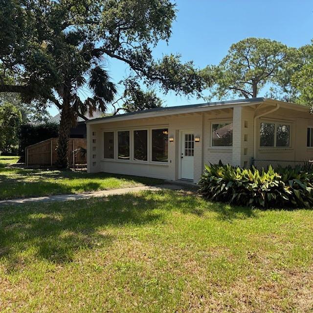 29 Snipe St, New Orleans, LA 70124 - rear view of house with a lawn