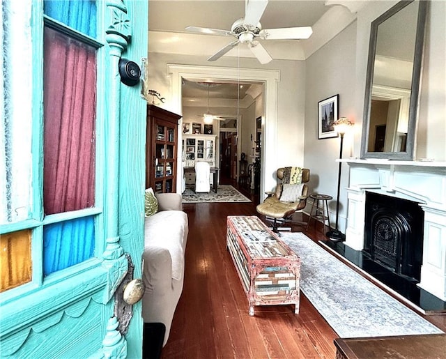 91315 Arabella St, New Orleans, LA 70115 - living room with ceiling fan, a fireplace with raised hearth, and hardwood / wood-style floors