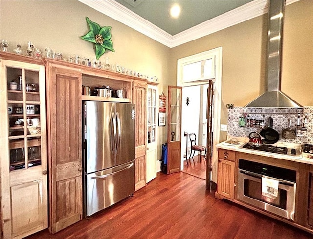 91315 Arabella St, New Orleans, LA 70115 - kitchen featuring stainless steel appliances, wall chimney range hood, ornamental molding, dark wood finished floors, and light countertops