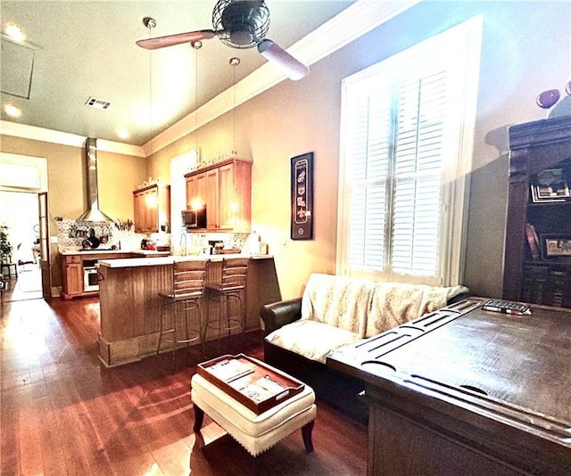 91315 Arabella St, New Orleans, LA 70115 - living room featuring dark wood-style floors, ceiling fan, and crown molding