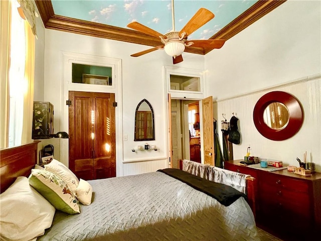 91315 Arabella St, New Orleans, LA 70115 - bedroom featuring ornamental molding, a wainscoted wall, and a ceiling fan