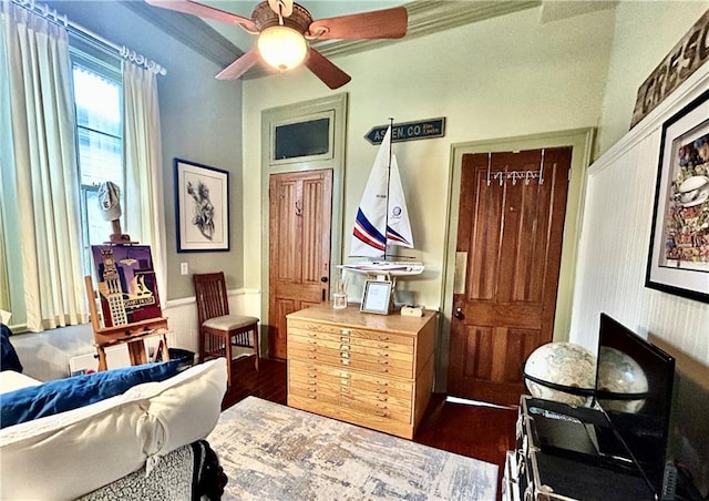91315 Arabella St, New Orleans, LA 70115 - sitting room with dark wood-style flooring, a ceiling fan, and ornamental molding
