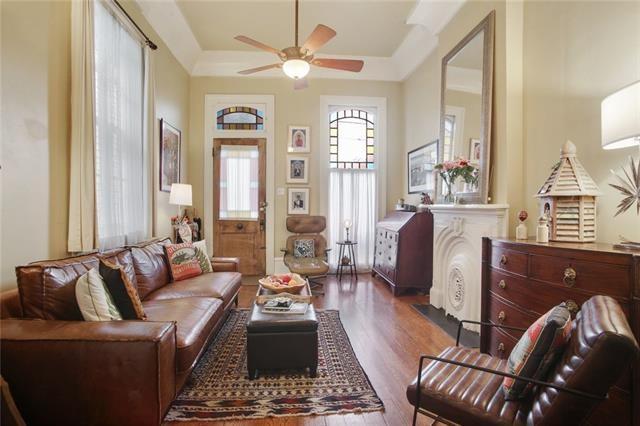 91315 Arabella St, New Orleans, LA 70115 - living room with wood finished floors and a ceiling fan