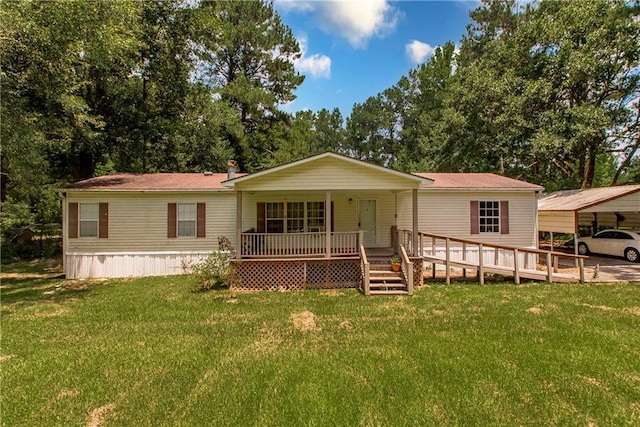 25169 Stepp Rd, Robert, LA 70455 - view of front of house featuring a front yard, a porch, and a detached carport