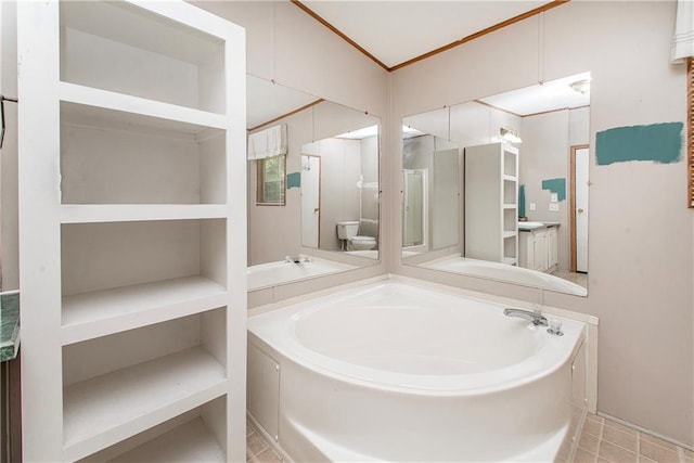 25169 Stepp Rd, Robert, LA 70455 - bathroom featuring a garden tub and crown molding