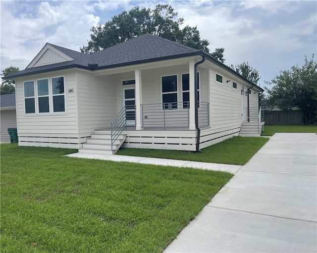 680 Hunterbrook Dr, Gretna, LA 70056 - view of front of house with covered porch, a shingled roof, and driveway