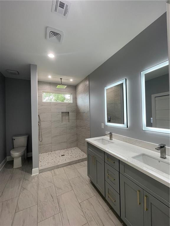 680 Hunterbrook Dr, Gretna, LA 70056 - full bath featuring double vanity, a tile shower, and marble finish flooring