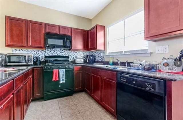 5817 Providence Pl, New Orleans, LA 70126 - kitchen featuring black appliances, reddish brown cabinets, dark countertops, and light tile patterned flooring