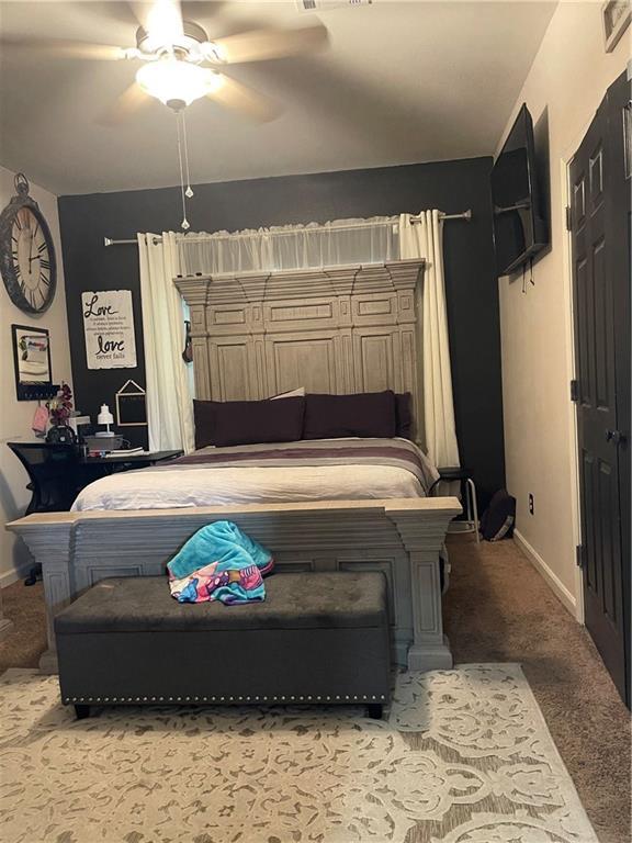 5817 Providence Pl, New Orleans, LA 70126 - bedroom with carpet and ceiling fan