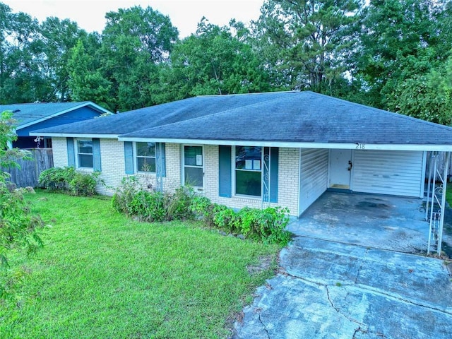 218 Mockingbird Ln, Slidell, LA 70458 - ranch-style house featuring roof with shingles, concrete driveway, brick siding, and a carport