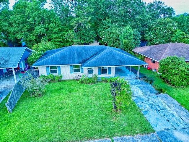 218 Mockingbird Ln, Slidell, LA 70458 - ranch-style home featuring concrete driveway, a carport, and a shingled roof