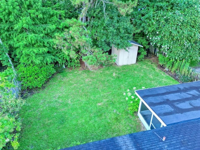 218 Mockingbird Ln, Slidell, LA 70458 - view of grassy yard with a storage shed