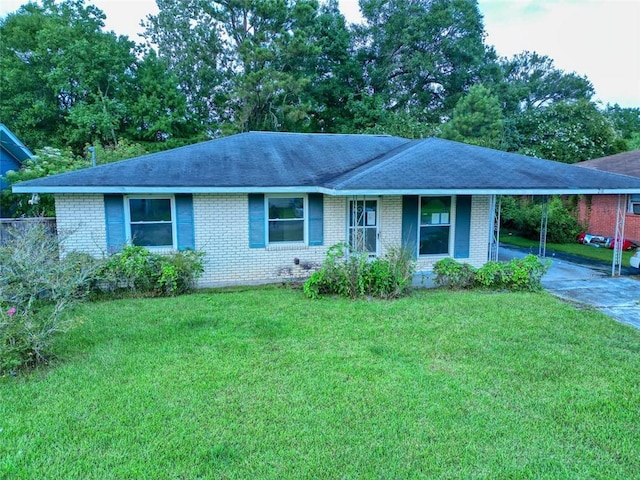 218 Mockingbird Ln, Slidell, LA 70458 - single story home with brick siding, concrete driveway, a front lawn, and a shingled roof