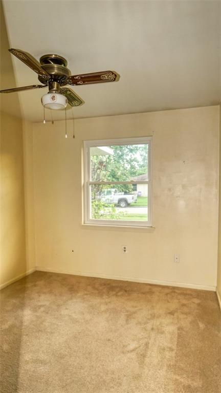 218 Mockingbird Ln, Slidell, LA 70458 - spare room featuring carpet and a ceiling fan