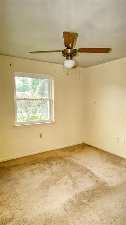 218 Mockingbird Ln, Slidell, LA 70458 - carpeted spare room with a ceiling fan and baseboards