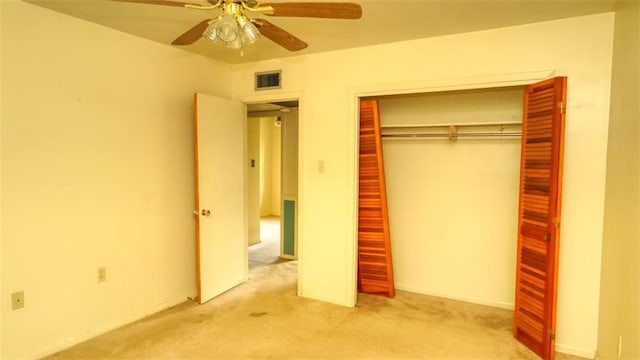 218 Mockingbird Ln, Slidell, LA 70458 - unfurnished bedroom with carpet flooring, a closet, and ceiling fan