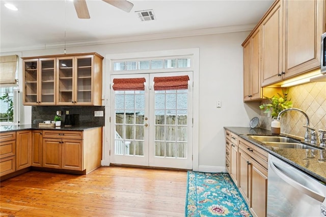 1906 Audubon St, New Orleans, LA 70118 - kitchen featuring stainless steel dishwasher, french doors, decorative backsplash, glass insert cabinets, and crown molding