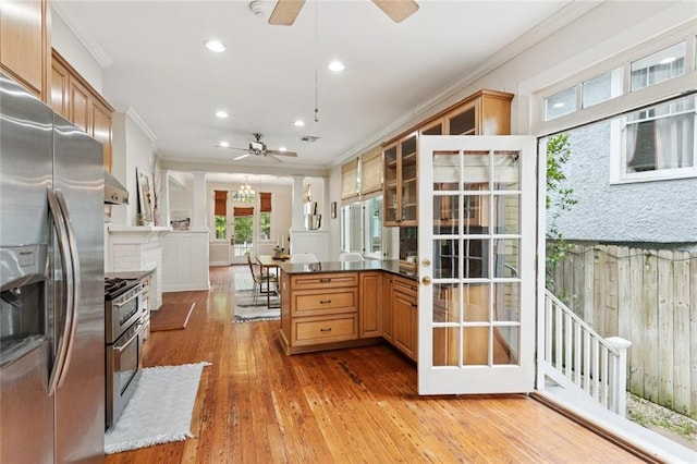 1906 Audubon St, New Orleans, LA 70118 - kitchen with appliances with stainless steel finishes, ceiling fan, ornamental molding, glass insert cabinets, and light wood-style floors