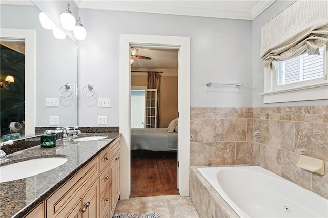 1906 Audubon St, New Orleans, LA 70118 - ensuite bathroom with ornamental molding, a bath, double vanity, and a ceiling fan