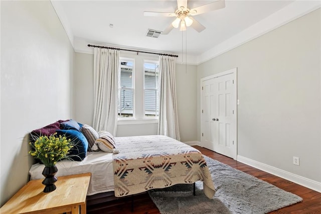 1906 Audubon St, New Orleans, LA 70118 - bedroom with wood finished floors, a ceiling fan, and ornamental molding