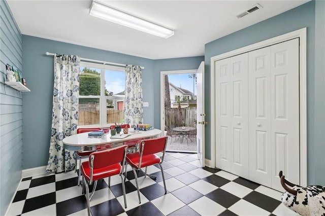 1906 Audubon St, New Orleans, LA 70118 - dining area featuring tile patterned floors and plenty of natural light