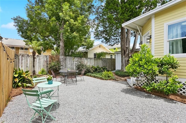 1906 Audubon St, New Orleans, LA 70118 - fenced backyard with a patio and outdoor dining area