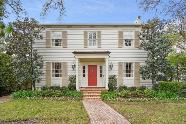 450 Fairway Dr, New Orleans, LA 70124 - view of front of home with a chimney and a front lawn
