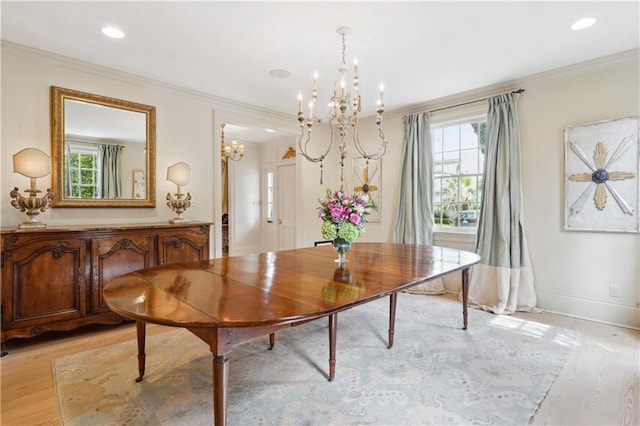 450 Fairway Dr, New Orleans, LA 70124 - dining space featuring a chandelier, light wood-style floors, healthy amount of natural light, crown molding, and recessed lighting