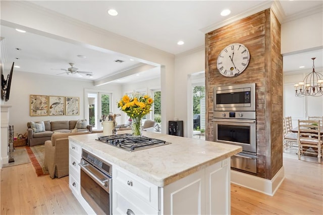 450 Fairway Dr, New Orleans, LA 70124 - kitchen with appliances with stainless steel finishes, a warming drawer, recessed lighting, light wood-type flooring, and white cabinets