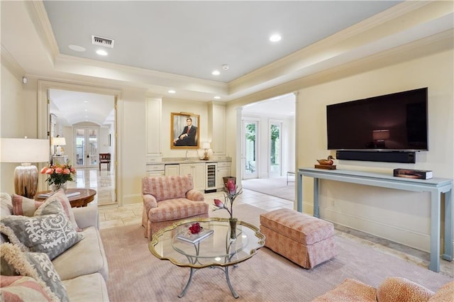 450 Fairway Dr, New Orleans, LA 70124 - living area featuring beverage cooler, healthy amount of natural light, a tray ceiling, ornamental molding, and recessed lighting