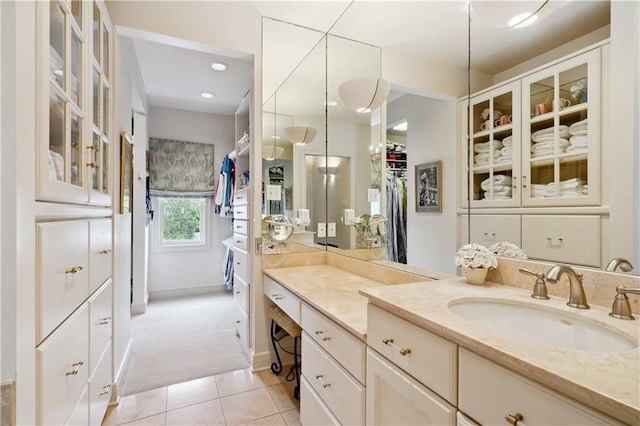450 Fairway Dr, New Orleans, LA 70124 - bathroom featuring vanity, tile patterned floors, a spacious closet, and recessed lighting